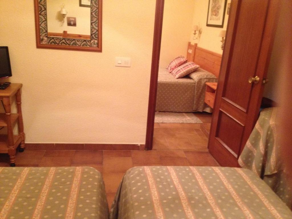 Postel nebo postele na pokoji v ubytování Hotel Esther