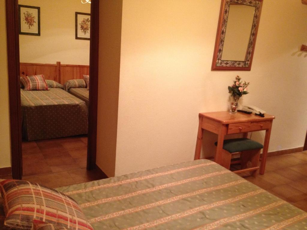 Postel nebo postele na pokoji v ubytování Hotel Esther