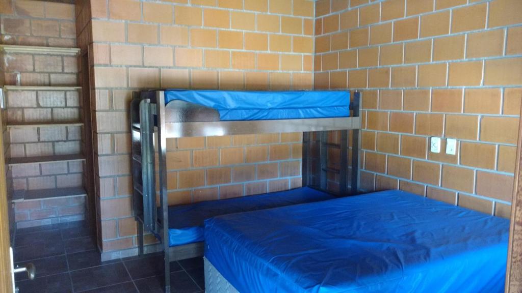 Chacara Dois Lagos - Mairinque tesisinde bir odada yatak veya yataklar