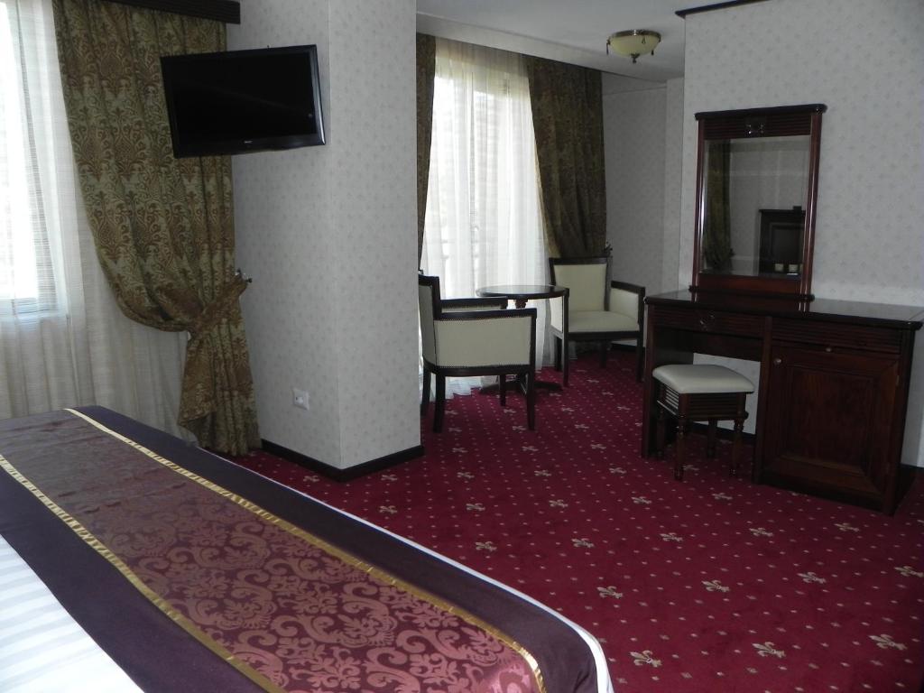 TV a/nebo společenská místnost v ubytování Hestia Hotel