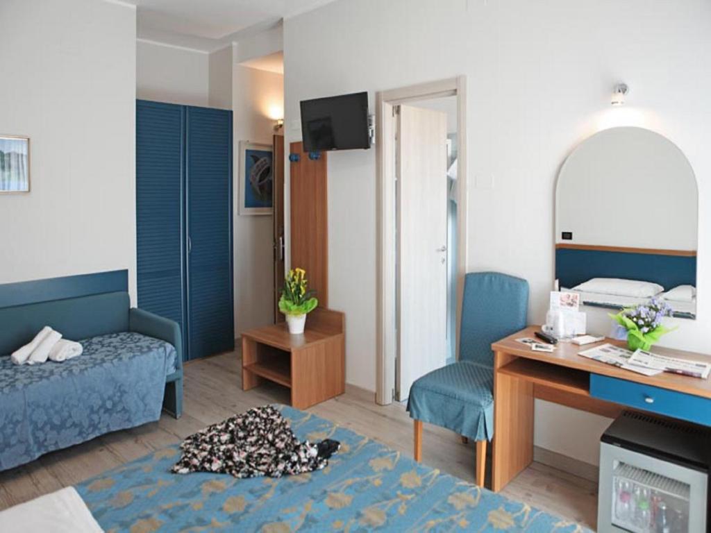 Кровать или кровати в номере Hotel Mondial