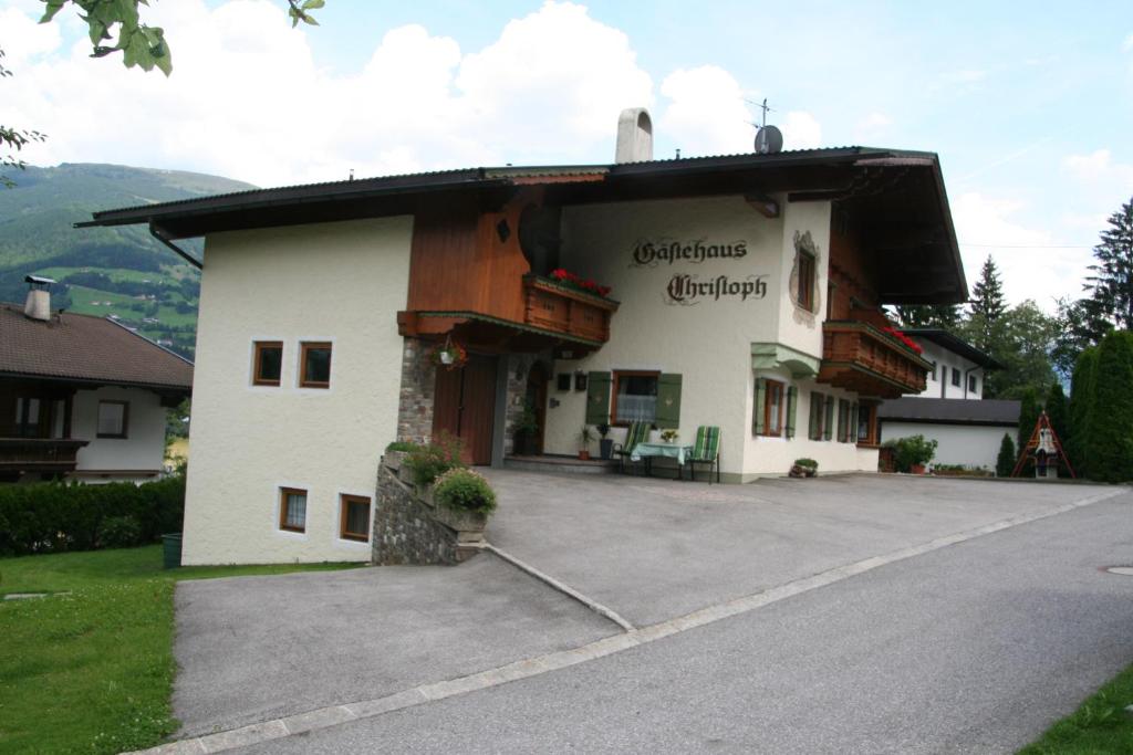 a building with a sign on the side of it at Gästehaus Christoph in Ried im Zillertal