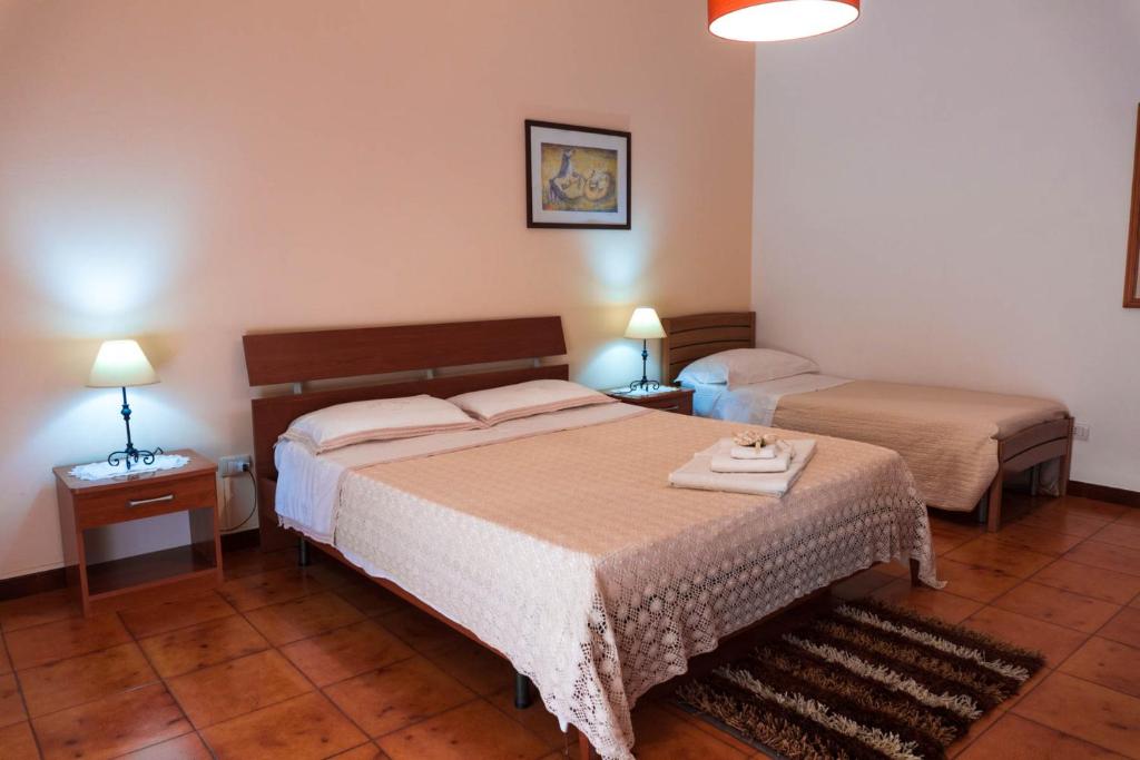 Postel nebo postele na pokoji v ubytování B&B Ulisse