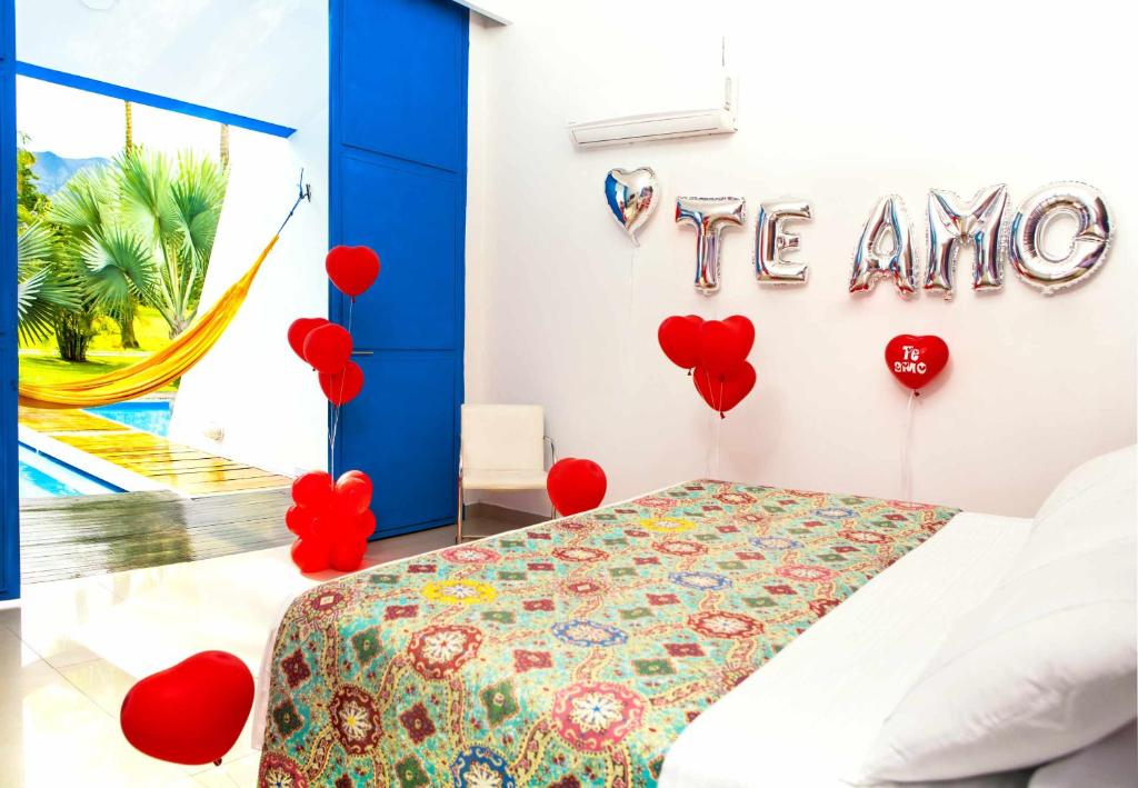 Postel nebo postele na pokoji v ubytování Hotel y Spa Santa Fe Colonial