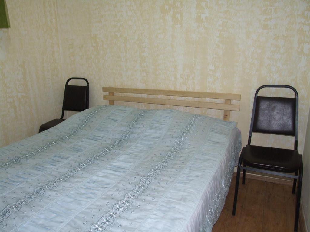 Postel nebo postele na pokoji v ubytování Farmer's Guest House