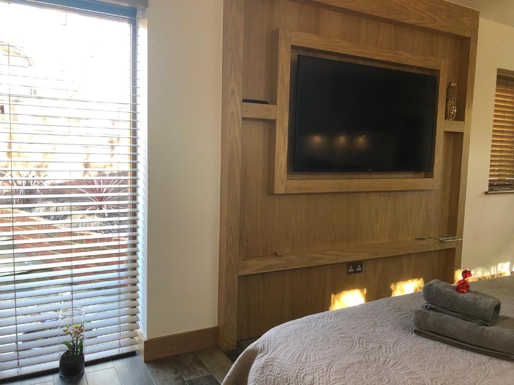 A television and/or entertainment center at Emsworth Studio 