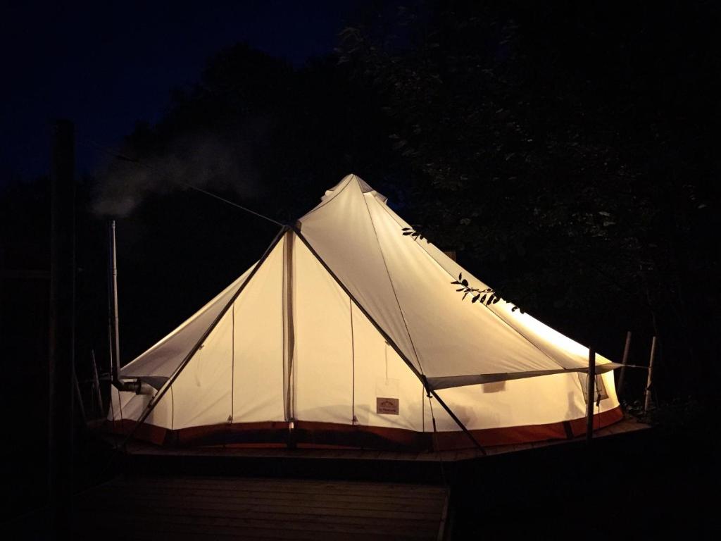 a white tent with smoke coming out of it at Silver Trees - Glamping in Fresse-sur-Moselle