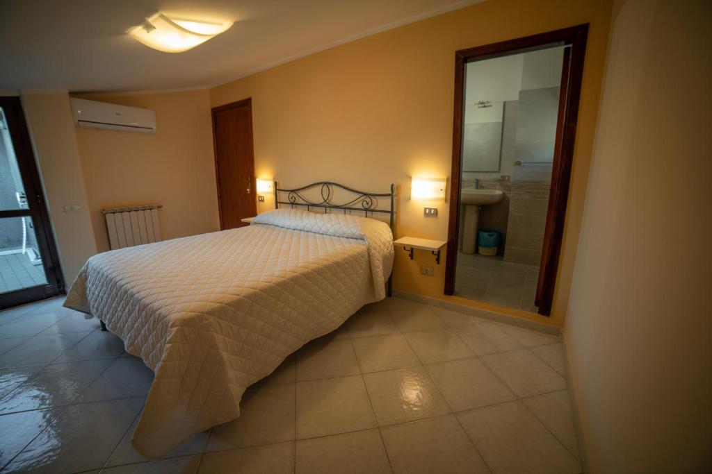 Postel nebo postele na pokoji v ubytování b&b Oikos