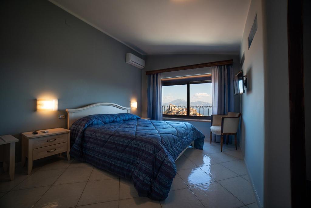Postel nebo postele na pokoji v ubytování b&b Oikos
