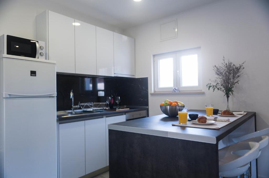 Kuchyňa alebo kuchynka v ubytovaní I.P.S. Apartment