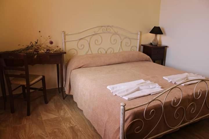 Postel nebo postele na pokoji v ubytování Agriturismo Zio Zac