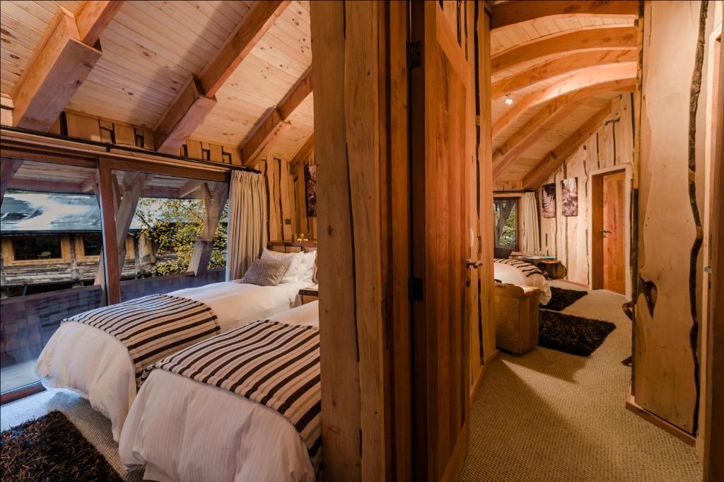 Letto o letti in una camera di Huilo Huilo Reino Fungi