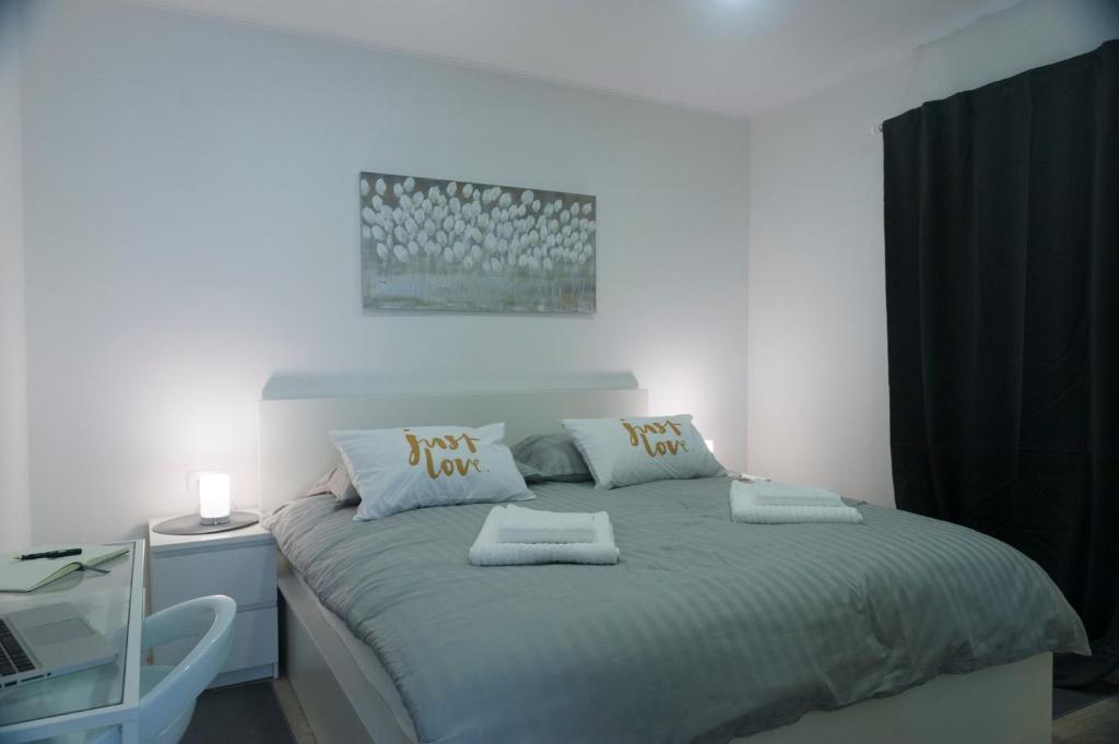 Posteľ alebo postele v izbe v ubytovaní I.P.S. Apartment
