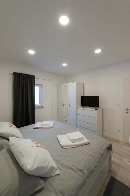 Posteľ alebo postele v izbe v ubytovaní I.P.S. Apartment