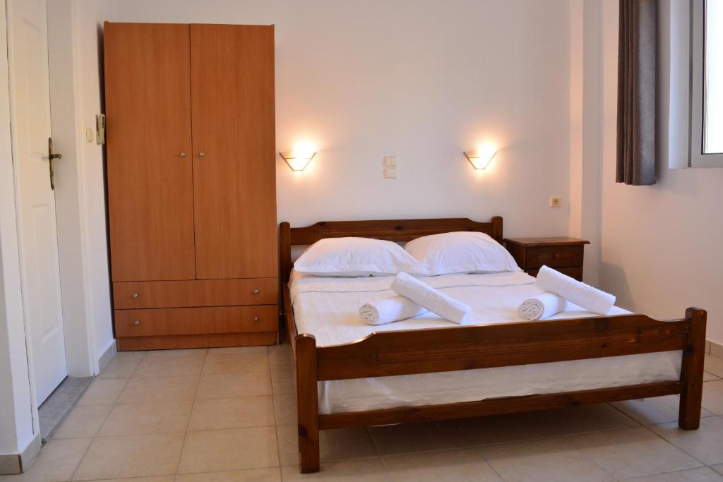 A bed or beds in a room at Raph's Studios-Apts By The Sea