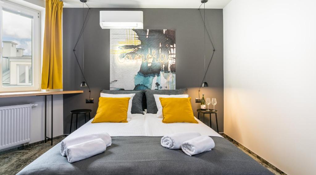 Posteľ alebo postele v izbe v ubytovaní Camera Apartments