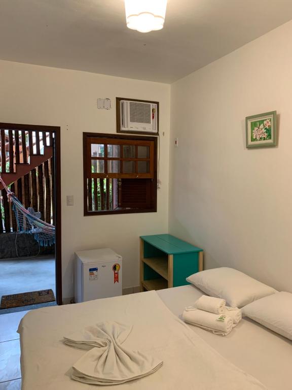 Postel nebo postele na pokoji v ubytování Biergarten Suites