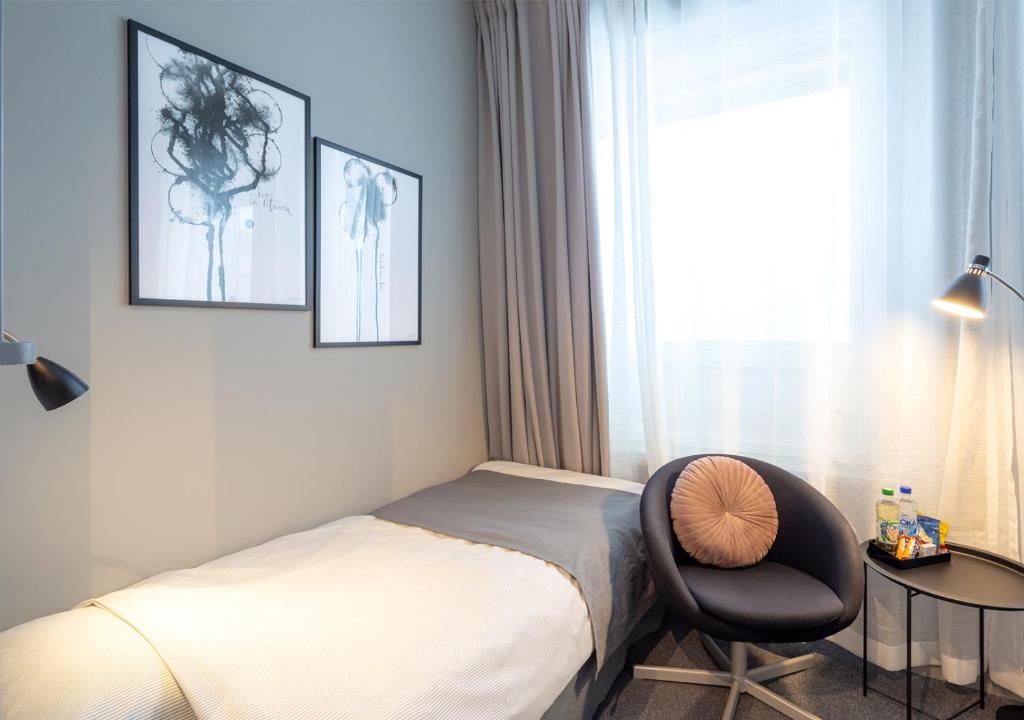 Postel nebo postele na pokoji v ubytování Hotell Leksand