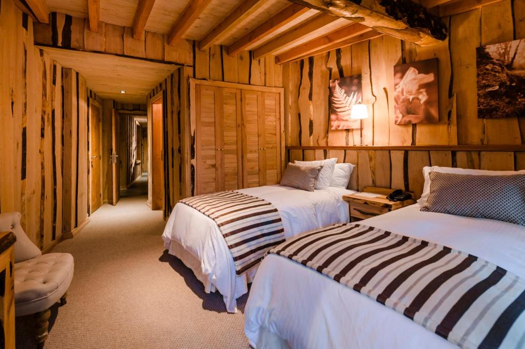 Letto o letti in una camera di Huilo Huilo Reino Fungi