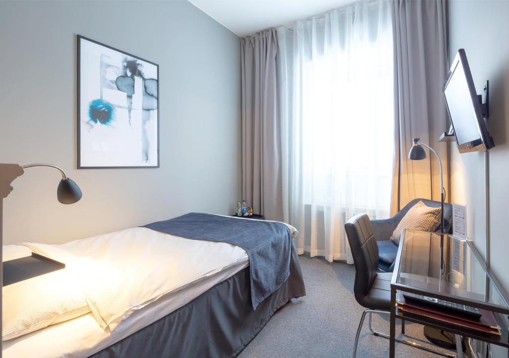Postel nebo postele na pokoji v ubytování Hotell Leksand