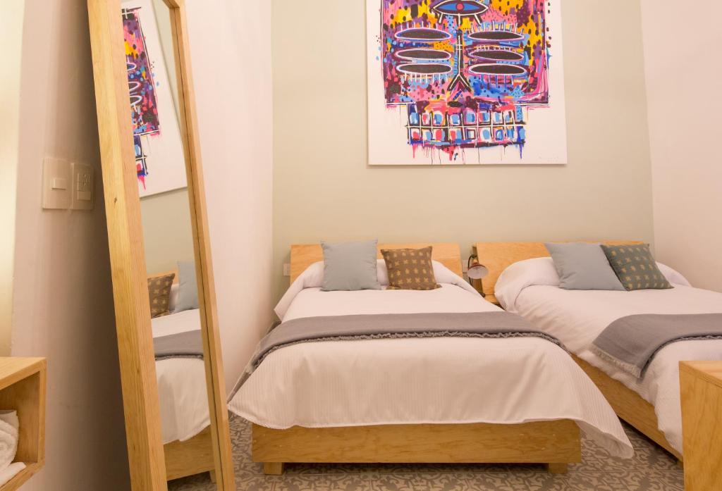 Postel nebo postele na pokoji v ubytování Hotel Casona Independencia