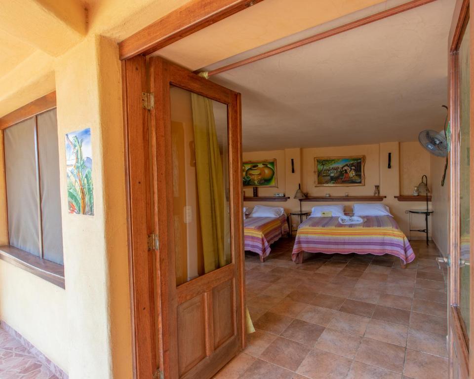 Postel nebo postele na pokoji v ubytování Villa Mango B&B