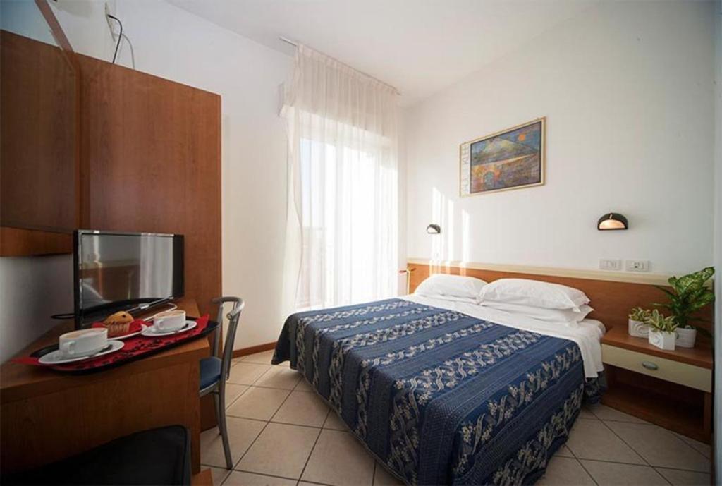Postel nebo postele na pokoji v ubytování Hotel Jana