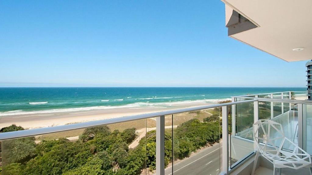 a balcony with a view of a beach and the ocean at Amira Penthouse Main Beach in Gold Coast