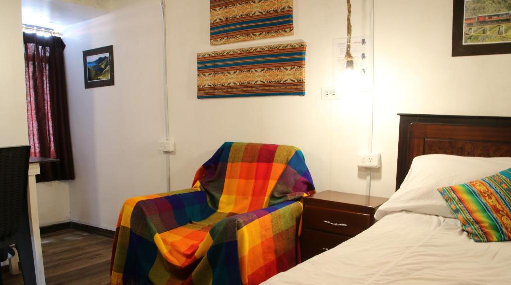 Postel nebo postele na pokoji v ubytování Hospedaje Los Ponchos