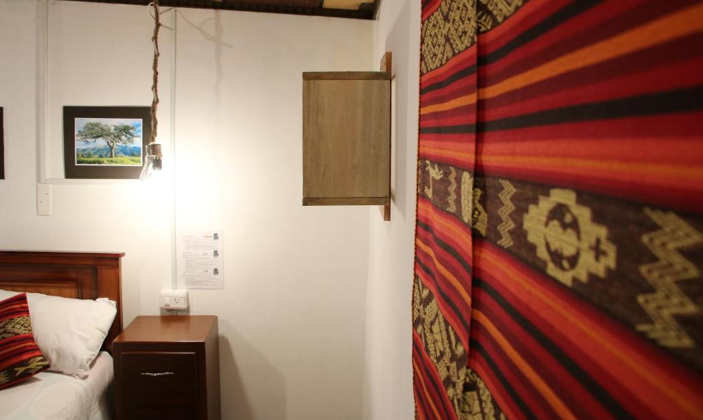 Postel nebo postele na pokoji v ubytování Hospedaje Los Ponchos
