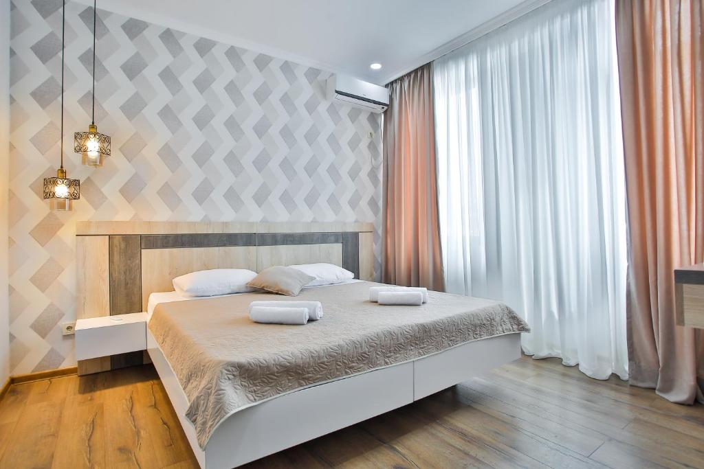 Postel nebo postele na pokoji v ubytování Hotel Terrace Kutaisi