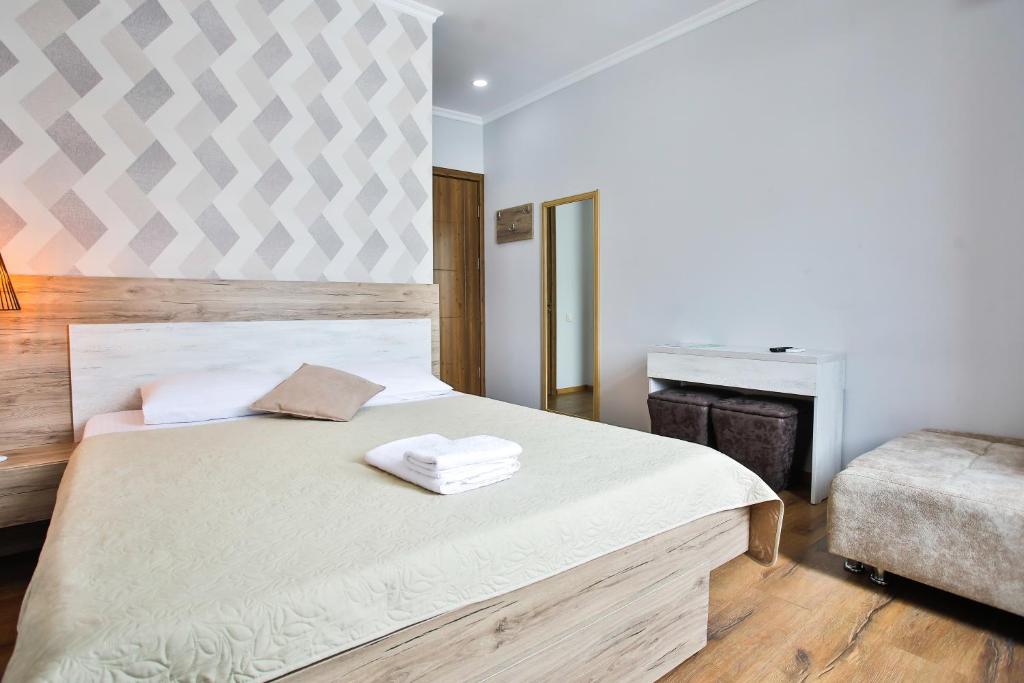 Postel nebo postele na pokoji v ubytování Hotel Terrace Kutaisi