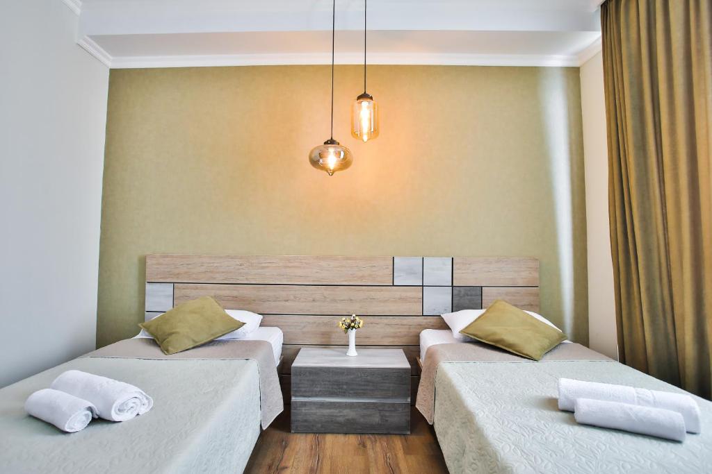 Postel nebo postele na pokoji v ubytování Hotel Terrace Kutaisi