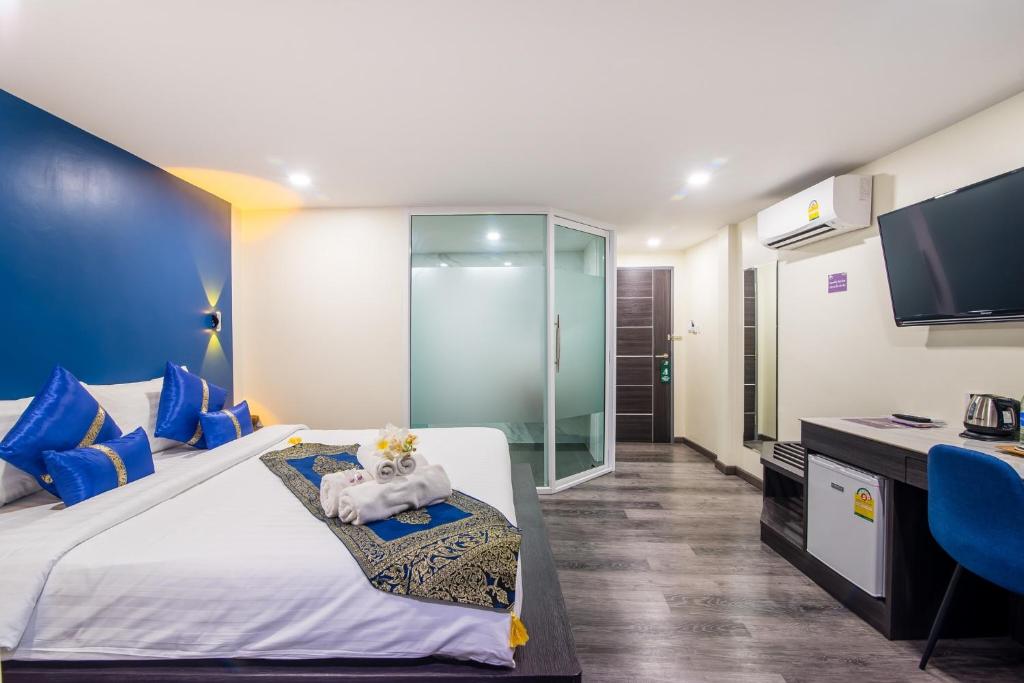 Uma cama ou camas num quarto em Anchan Hotel & Spa