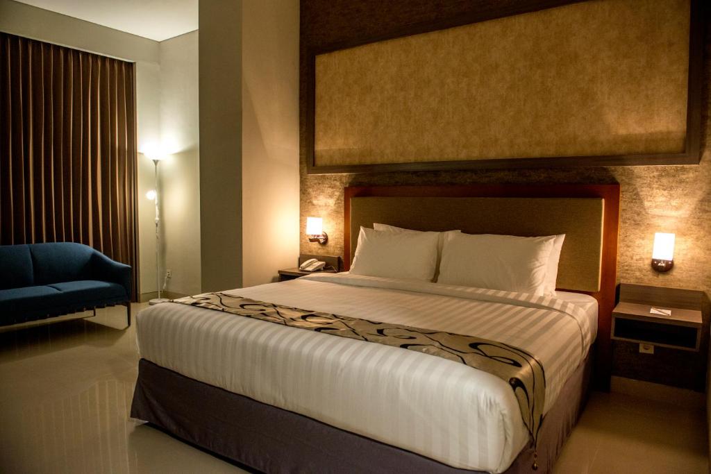 Postel nebo postele na pokoji v ubytování Grand Padis Hotel