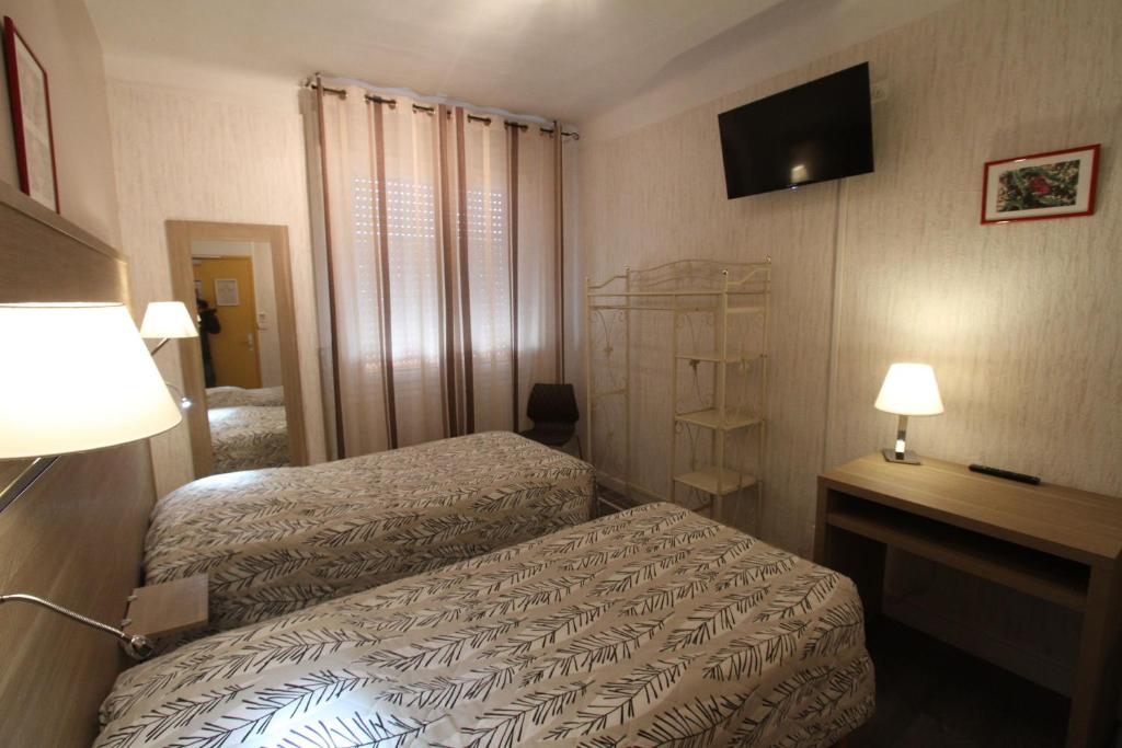 Postel nebo postele na pokoji v ubytování Le Provençal