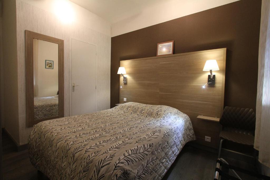 Postel nebo postele na pokoji v ubytování Le Provençal