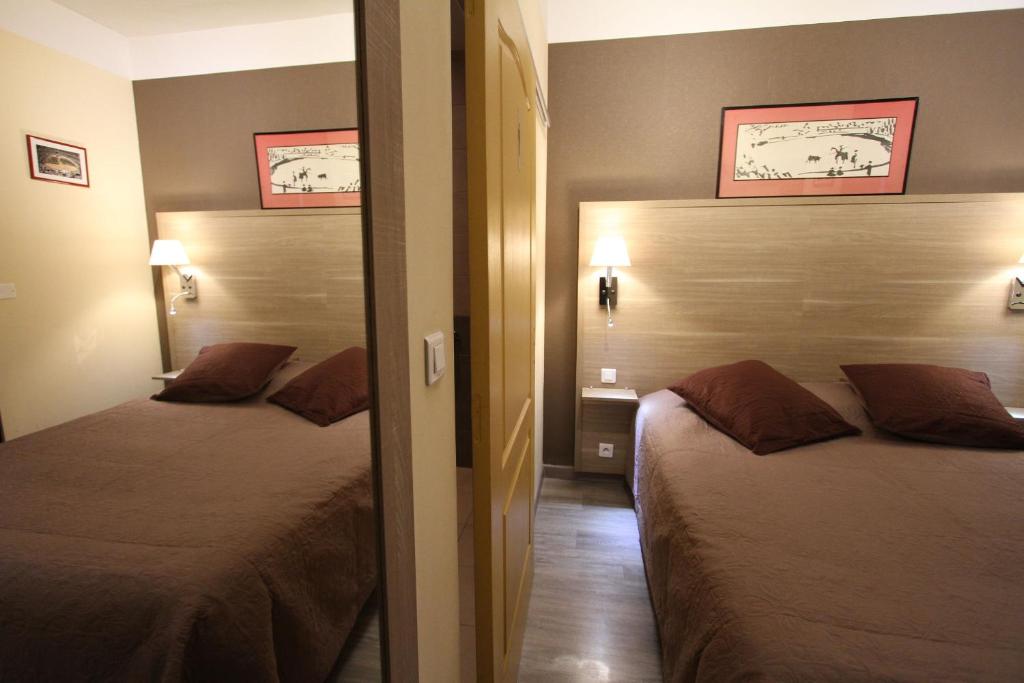 Postel nebo postele na pokoji v ubytování Le Provençal