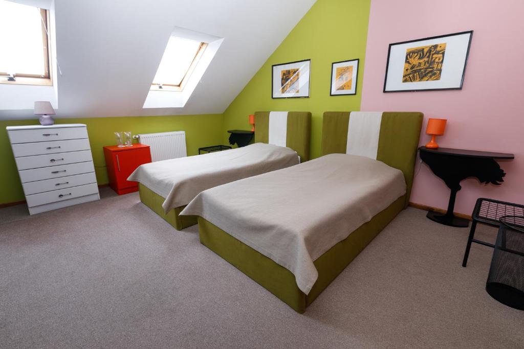 Postel nebo postele na pokoji v ubytování Art Garni Hotel