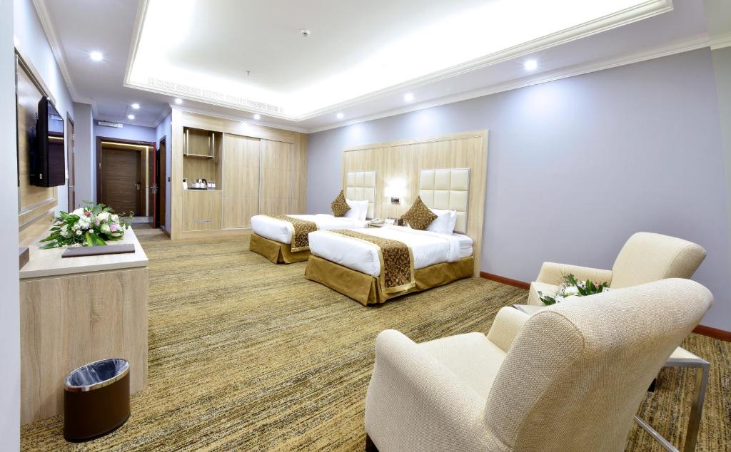 Postel nebo postele na pokoji v ubytování Iridium 70 Hotel