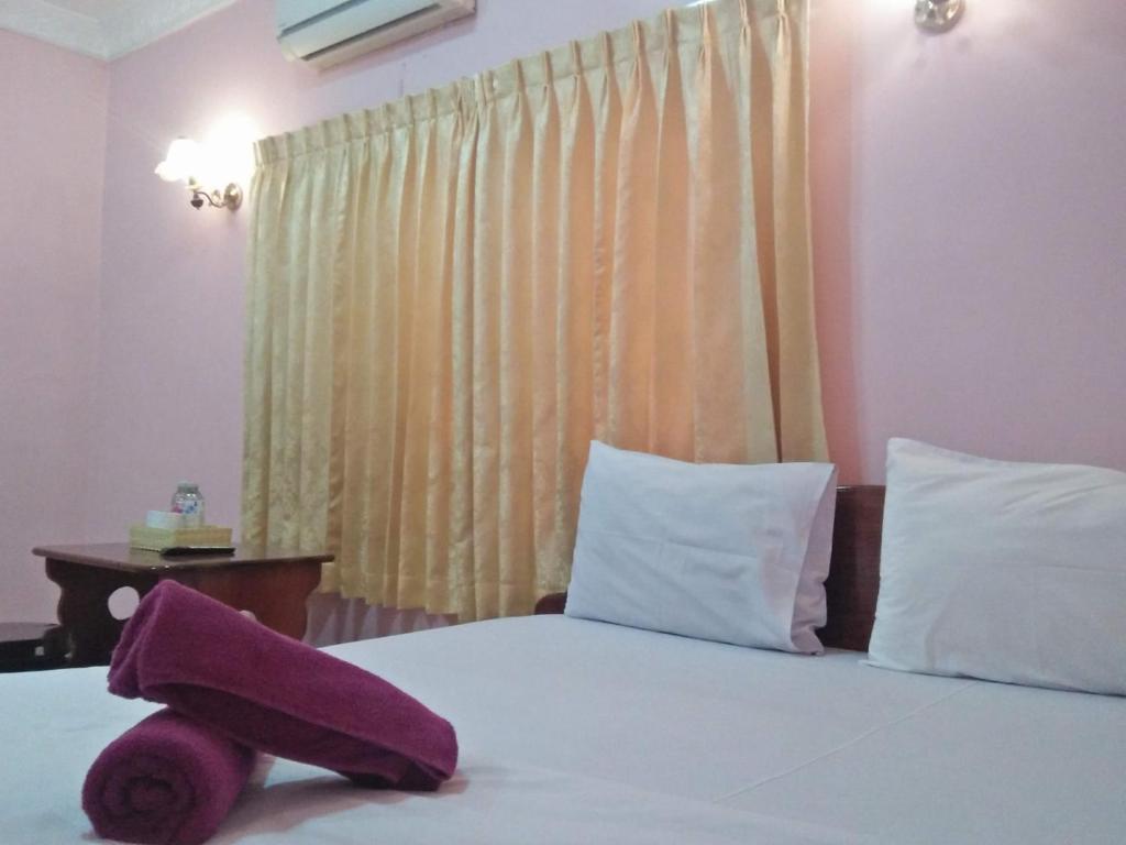 Postel nebo postele na pokoji v ubytování Sam So Guesthouse