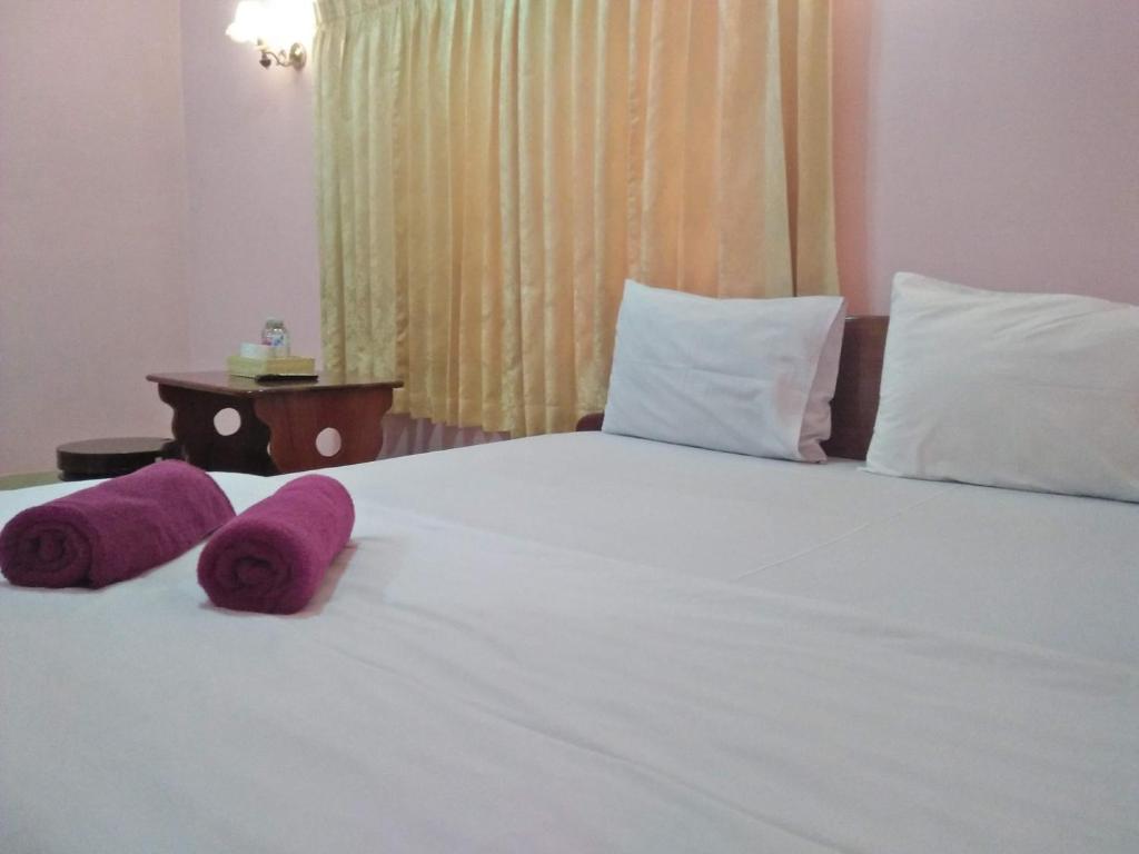 Postel nebo postele na pokoji v ubytování Sam So Guesthouse