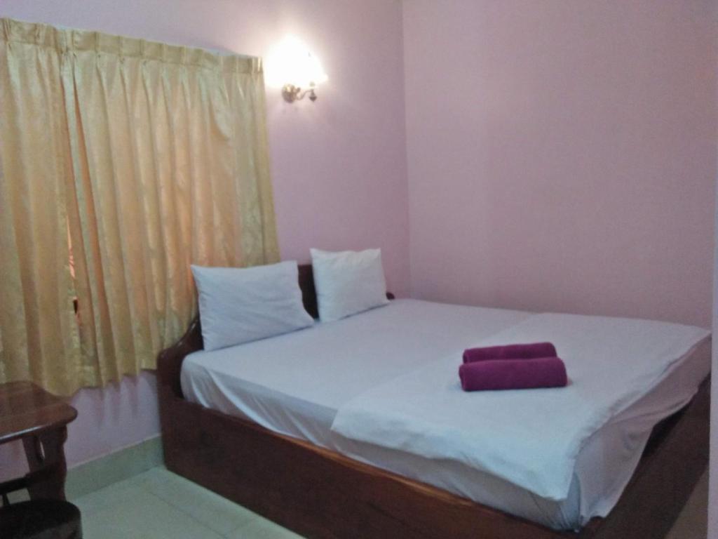 Postel nebo postele na pokoji v ubytování Sam So Guesthouse