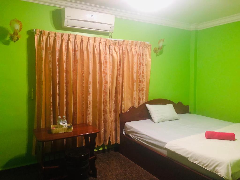 Postel nebo postele na pokoji v ubytování Sam So Guesthouse