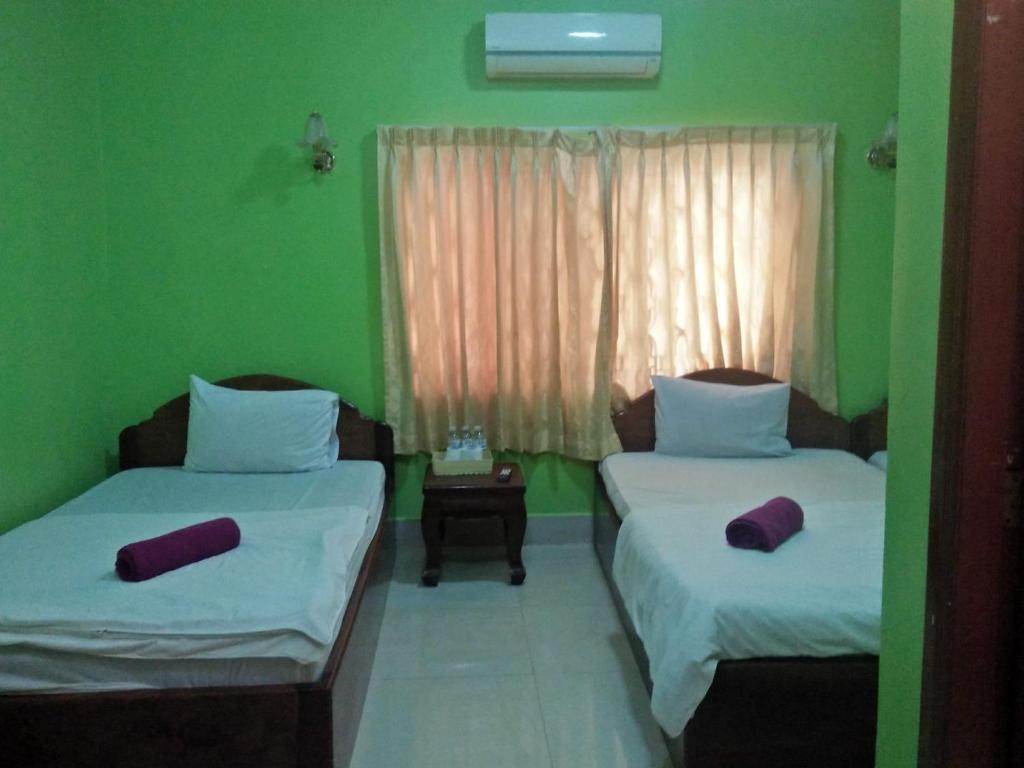Postel nebo postele na pokoji v ubytování Sam So Guesthouse