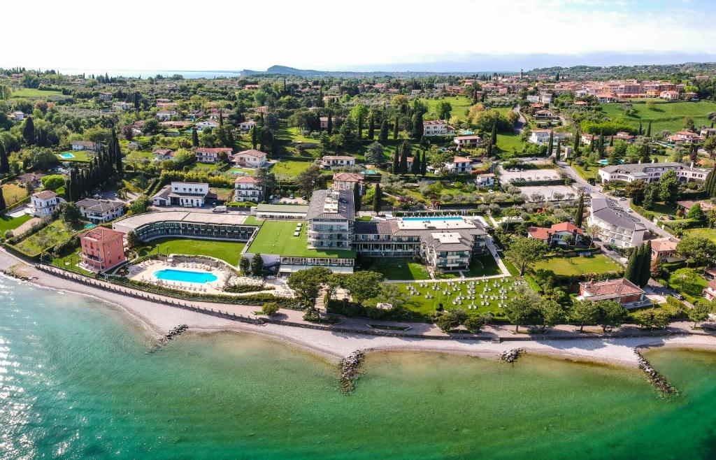 an aerial view of a mansion on the beach at Park Hotel Casimiro in San Felice del Benaco