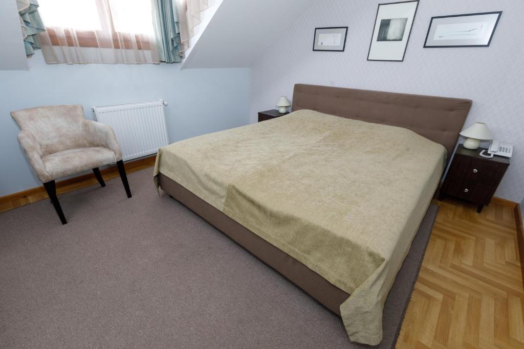 Postel nebo postele na pokoji v ubytování Art Garni Hotel