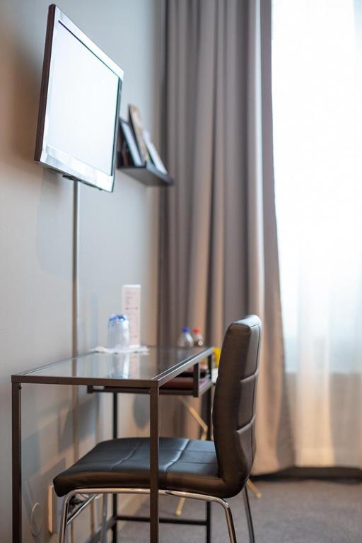 TV a/nebo společenská místnost v ubytování Hotell Leksand