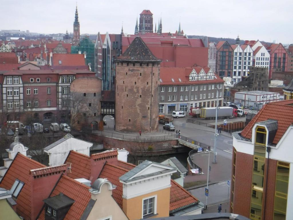 a view of a city with buildings and a clock tower at Apartament Długie Ogrody 2 pokojowy in Gdańsk