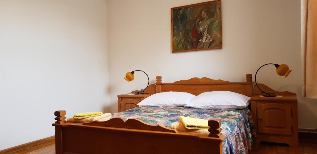 Posteľ alebo postele v izbe v ubytovaní Apartamenty Drewniany Dom